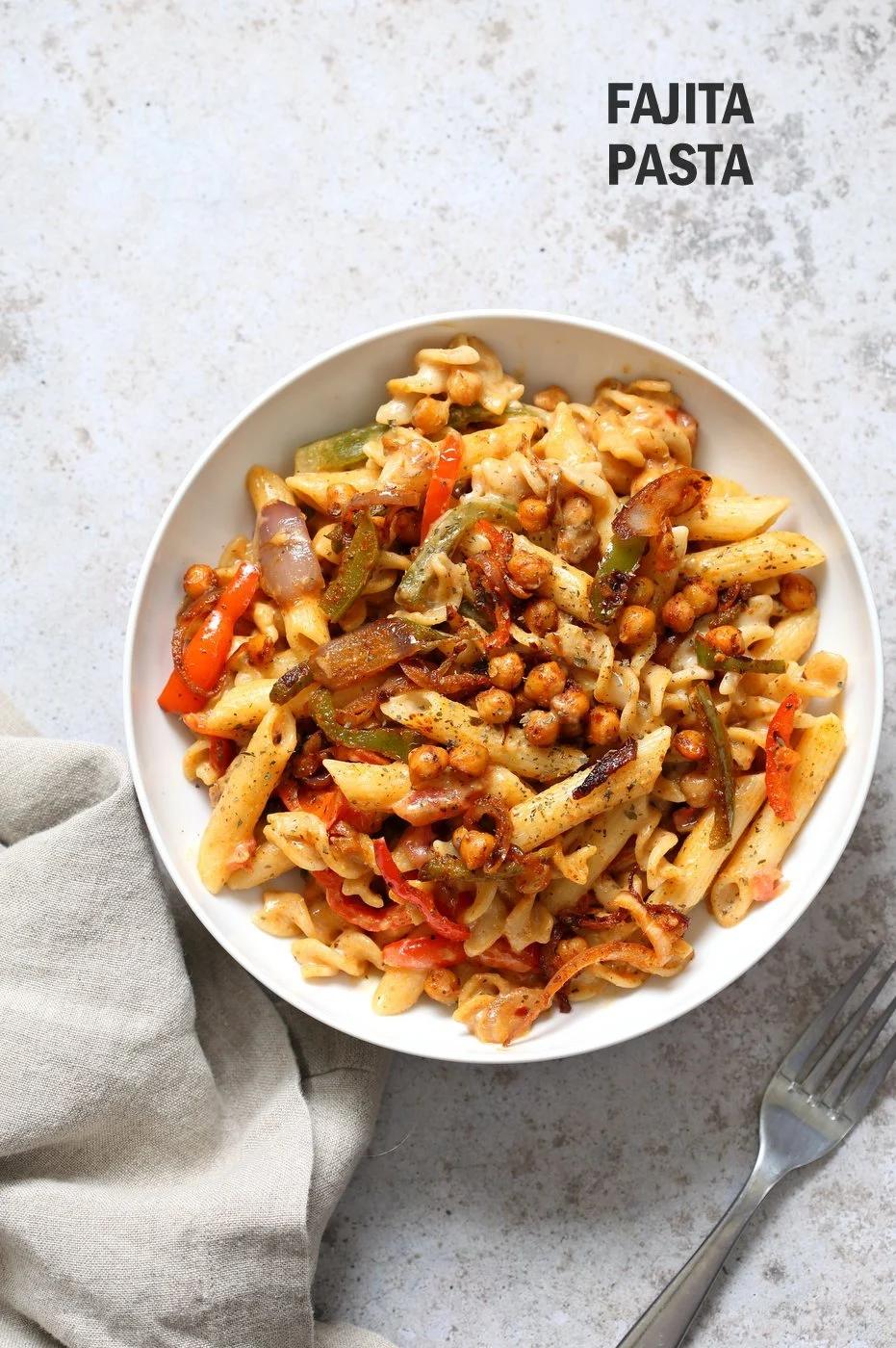 Vegan Fajita Pasta with Chickpeas and veggies. Easy Weeknight pasta with Taco seasoned veggies and beans mixed with creamy pasta. Vegan Soyfree Recipe. Can be gluten-free. #vegan #veganricha