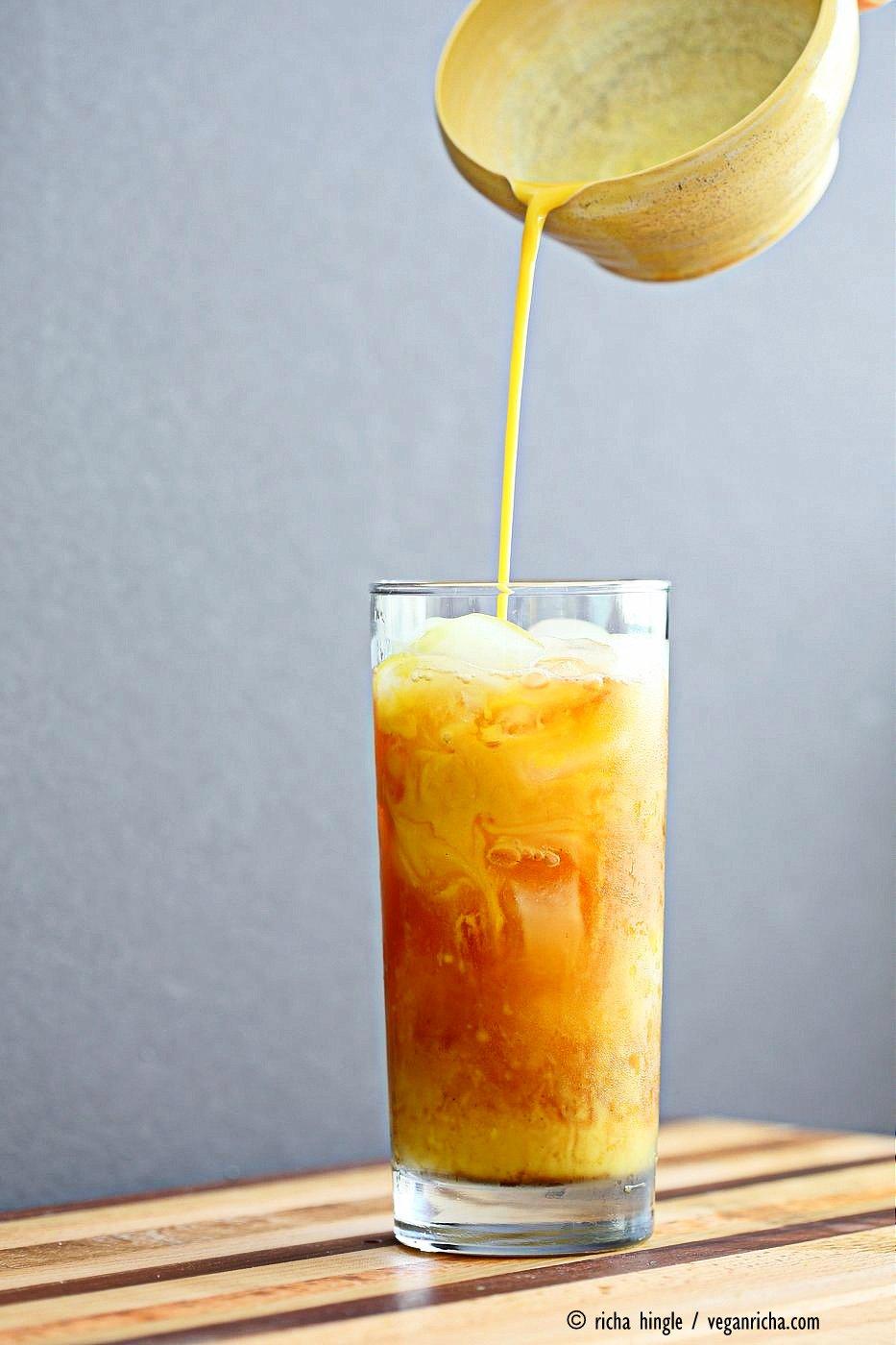 Cardamom Cinnamon Turmeric Iced Tea. Spiced Iced tea like Thai Iced tea with turmeric coconut milk and Indian masala chai spices and ginger. Golden Milk Iced Tea. Vegan Gluten-free Soy-free Recipe | VeganRicha.com