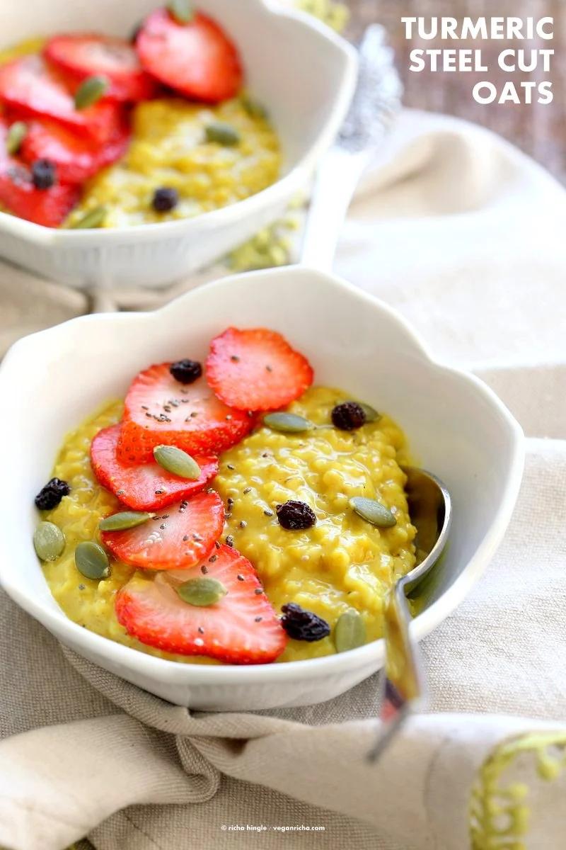 Turmeric Steel Cuts Oats with turmeric, cinnamon and cardamom. Serve with Strawberries, chia seeds and other garnishes of choice. Easy Make ahead Breakfast Recipe Vegan Glutenfree Soyfree.| VeganRicha.com