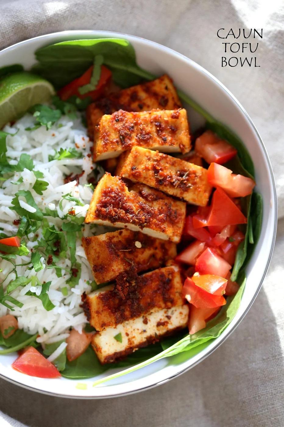Cajun Tofu with Cilantro Lime Rice. Baked Cajun Spiced Tofu, over greens, cilantro lime rice, and tomatoes. Easy Spicy Bowl. Vegan Gluten-free Nut-free Recipe. Use Chickpea tofu to make soy-free. | VeganRicha.com