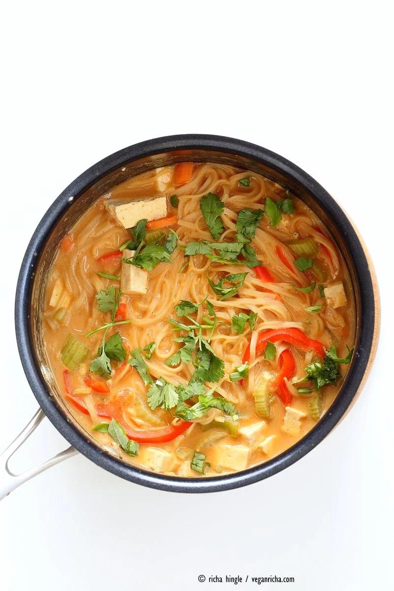 One pot peanut sauce noodles, Ready in 20 minutes! Brown Rice Noodles, Veggies, Peanut or Almond Butter, spices, flavors, boil and done. Easy Quick Weeknight Dinner Recipe | VeganRicha.com