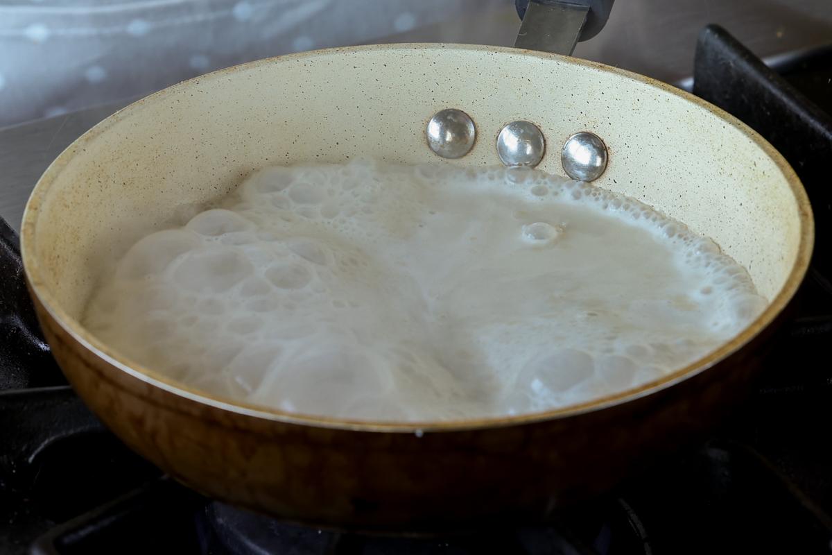 heating the vegan milk on the stove