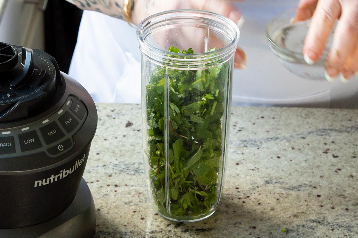 green sauce ingredients in the blender, before blending
