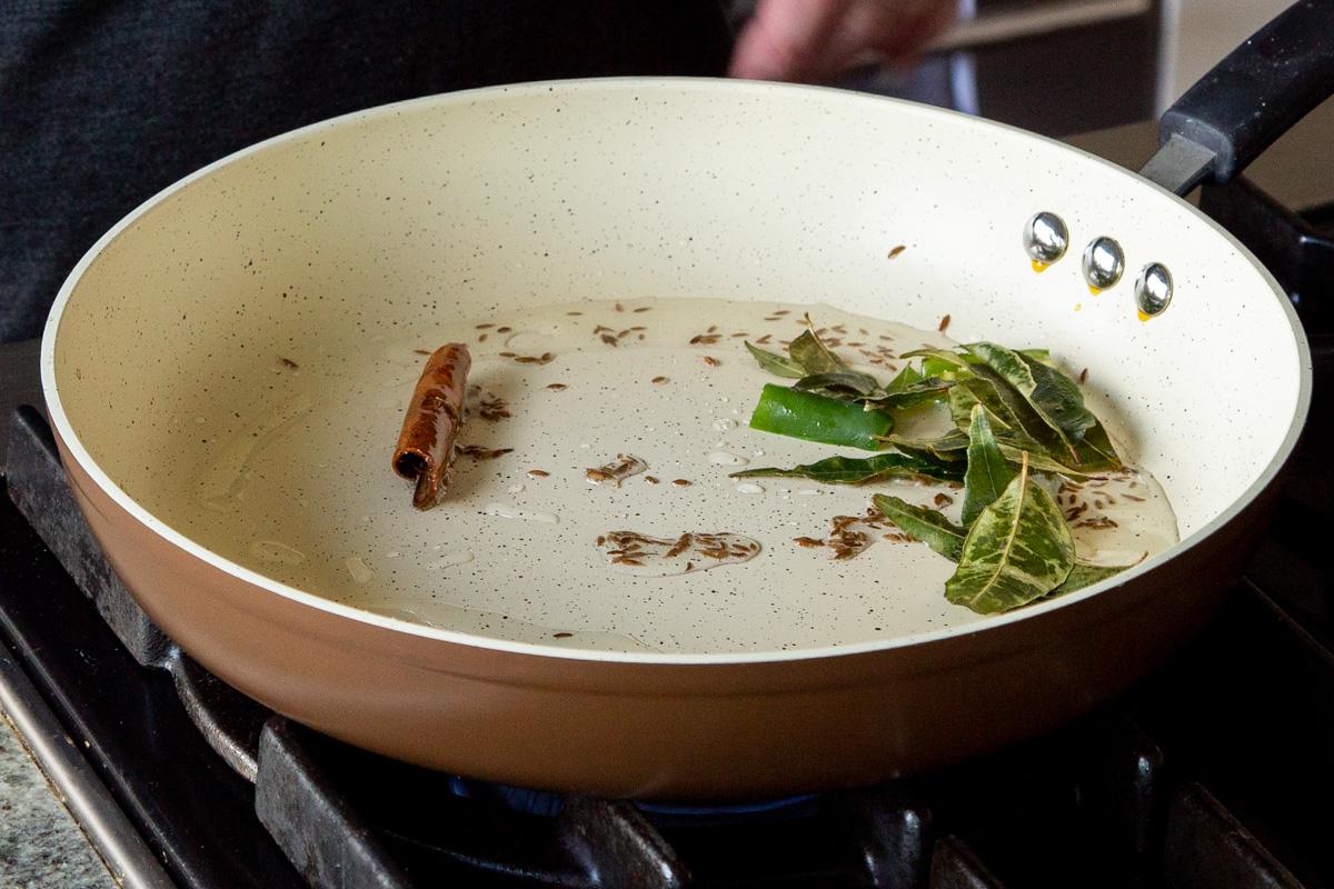 roasting the whole spices in the frying pan