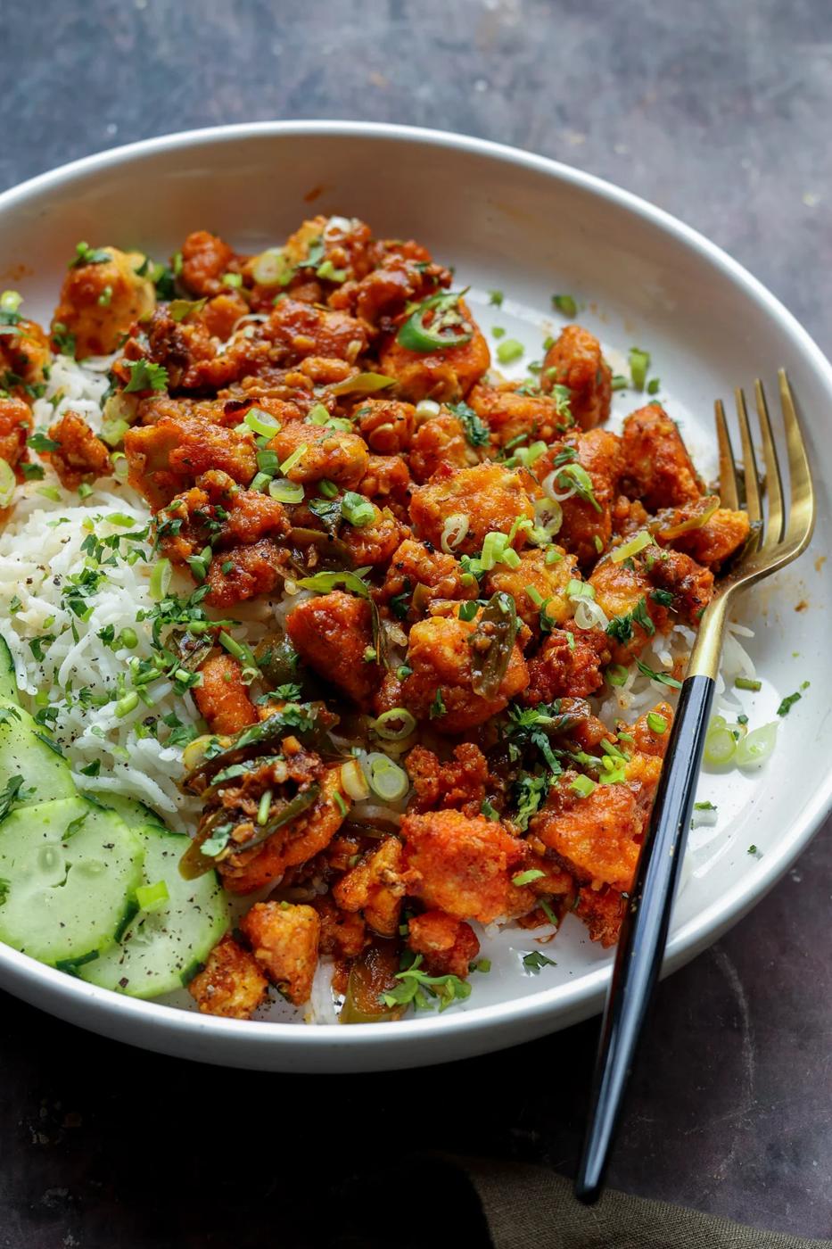 apollo tofu on a plate with rice and cucumber