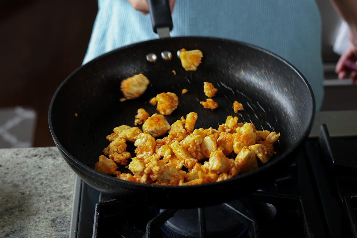 flipping the tofu in the pan