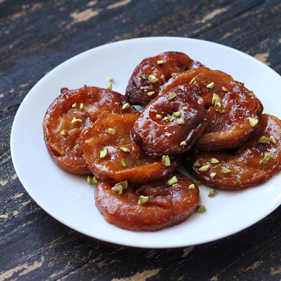 Apple Jalebi with Rabri – Apple Fritters soaked in saffron flavored syrup, served with Sweet Cream. Vegan Diwali Recipe