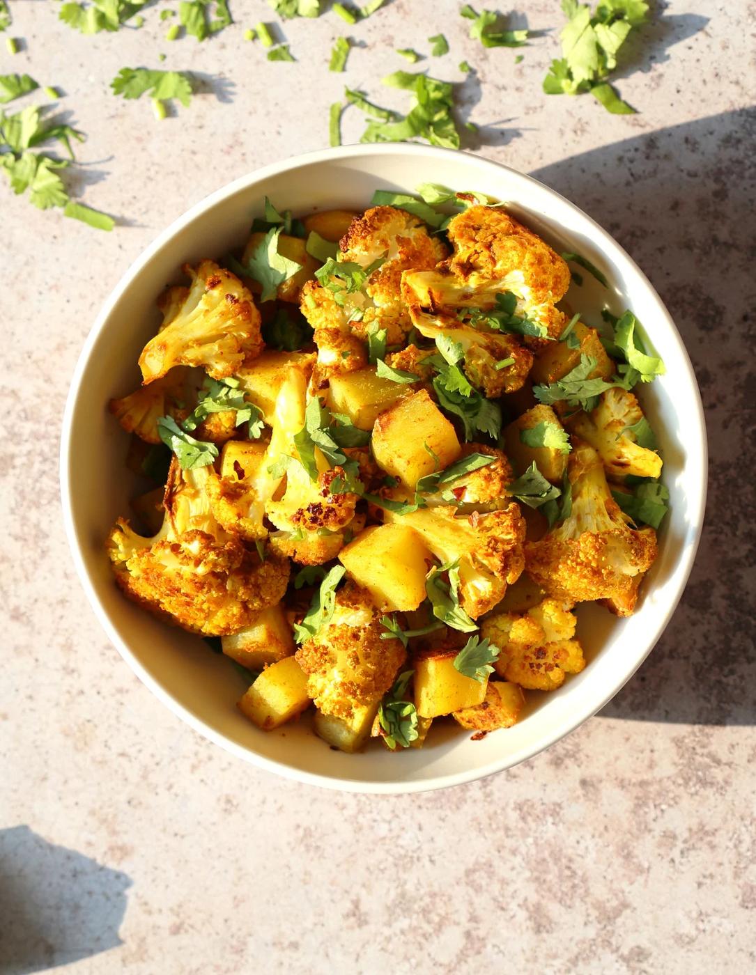 Baked Aloo Gobi - Indian Spiced Potato Cauliflower. 10 Mins Active. Toss with spices, put it to bake, and done! No Standing around, no Mushy Cauliflower! Same Amazing Indian flavor and excellent texture. Tips and options for Aloo Gobi Subzi that bakes perfectly every time! #Vegan #Glutenfree #Soyfree #Nutfree #VeganRicha #aloogobi #Recipe
