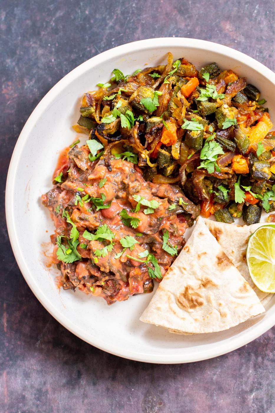 baked bhindi masala with tomato onion gravy sereved with flatbred and another curry