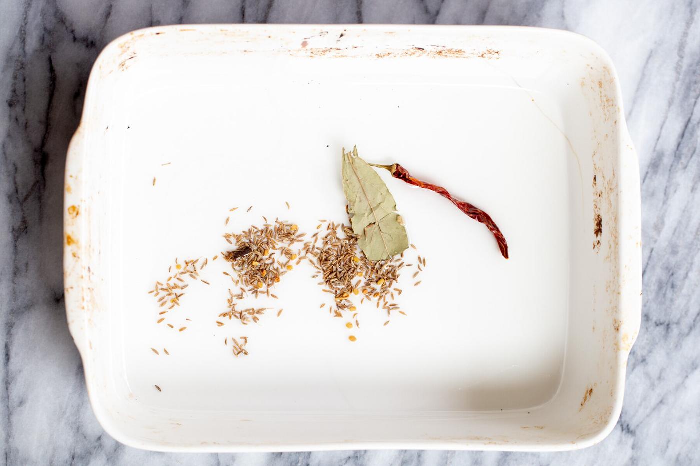 dried spices in a white casserole dish
