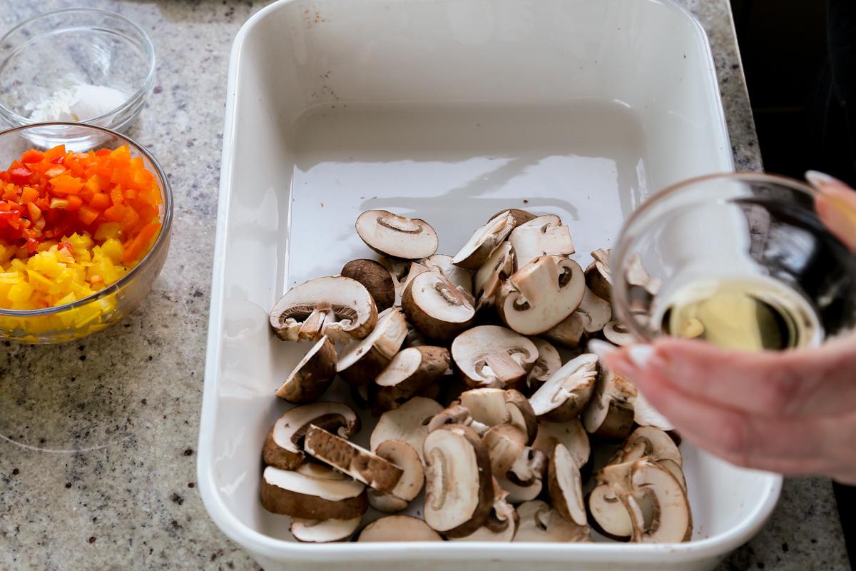 adding oil to the mushrooms