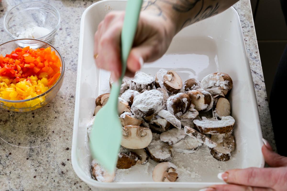adding cornstarch mixture to the mushrooms