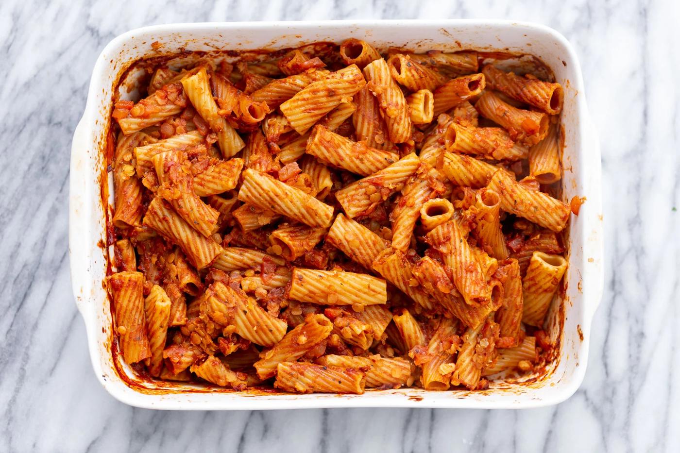 overhead shot of vegan baked rigatoni before vegan tofu cheese sauce is added