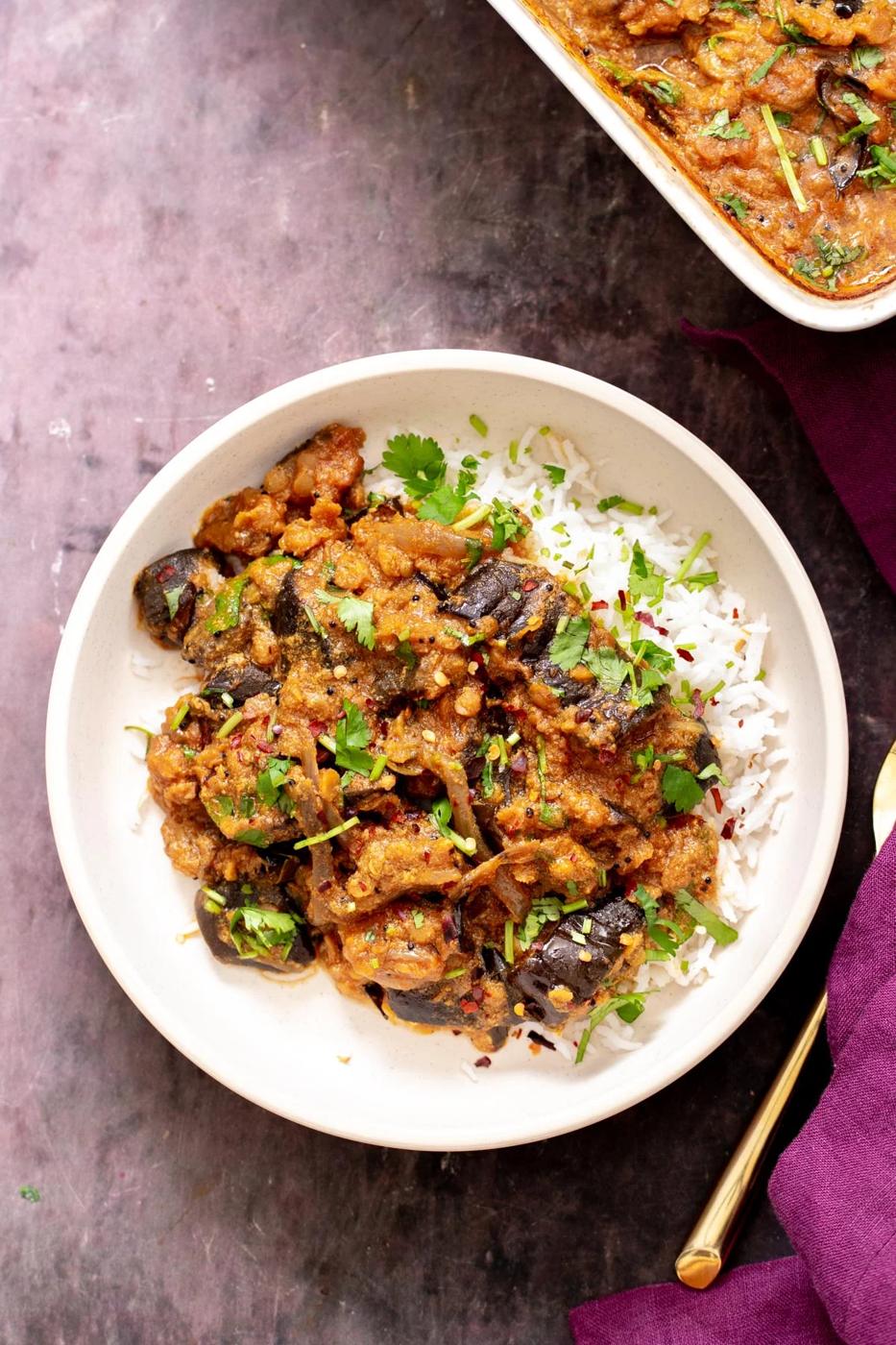baked eggplant curry served over rice sprinkled with cilantro