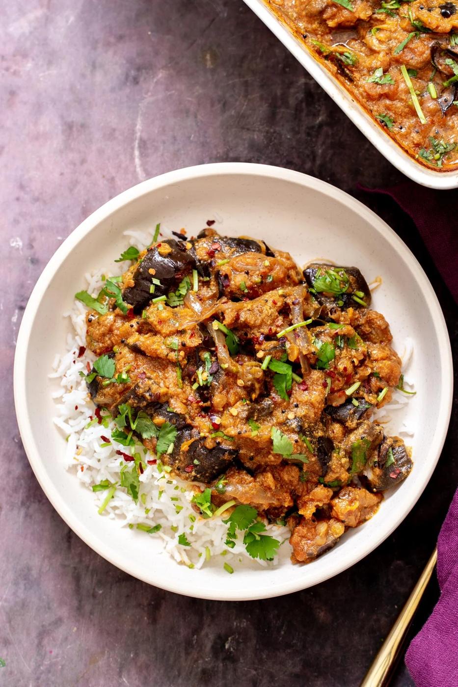 a serving of vegan eggplant casserole served over rice