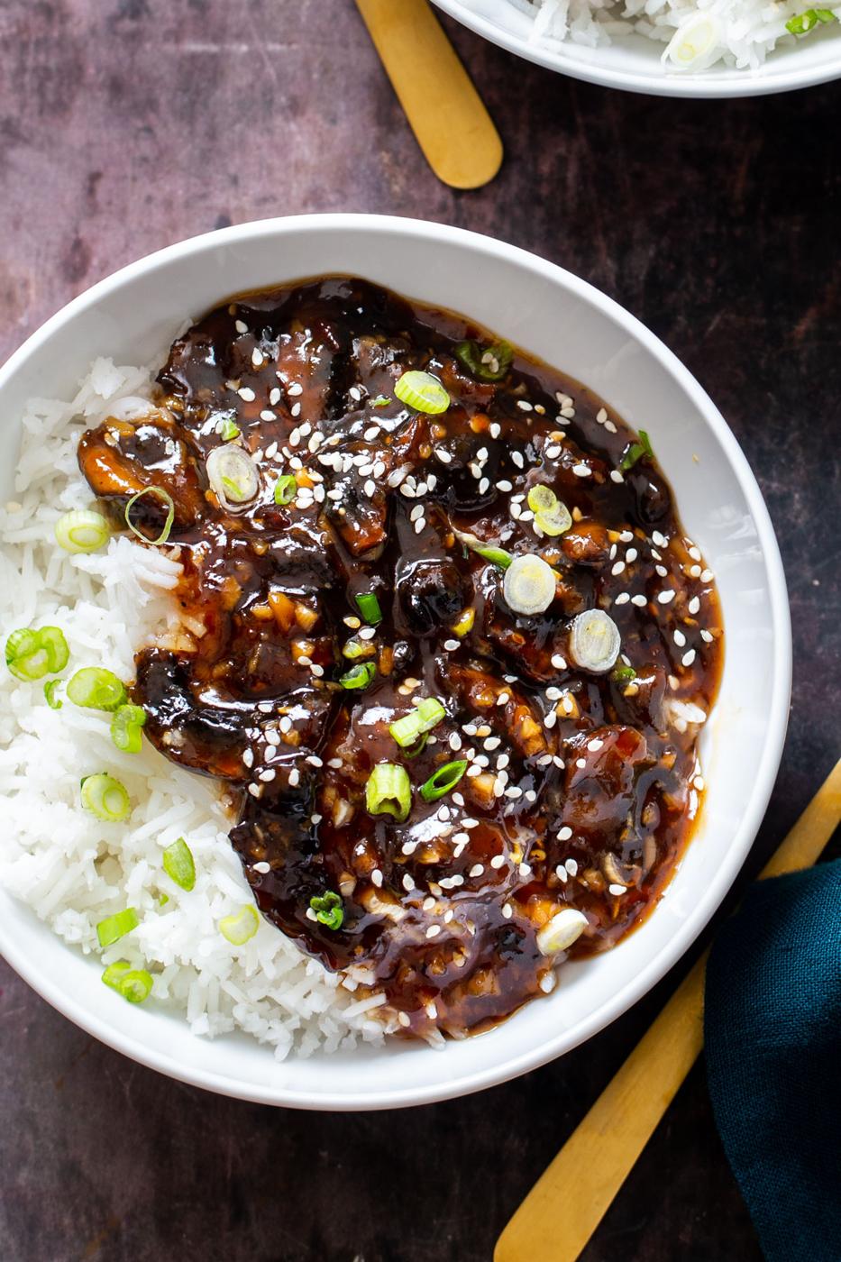 sticky sesame mushrooms served with rice and sprinkled with sesame seeds and green onions