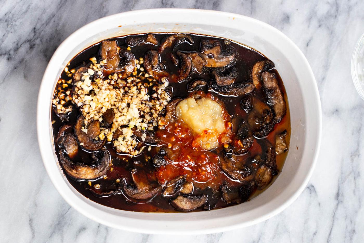 a casserole dish with baked sticky sesame mushrooms