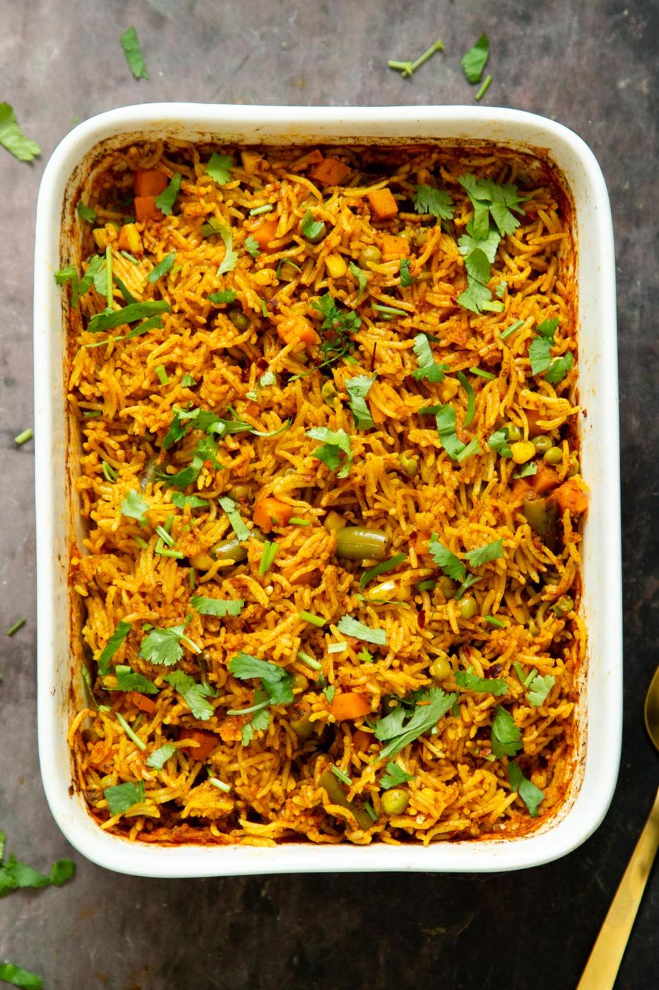 a casserole dish with baked masala rice