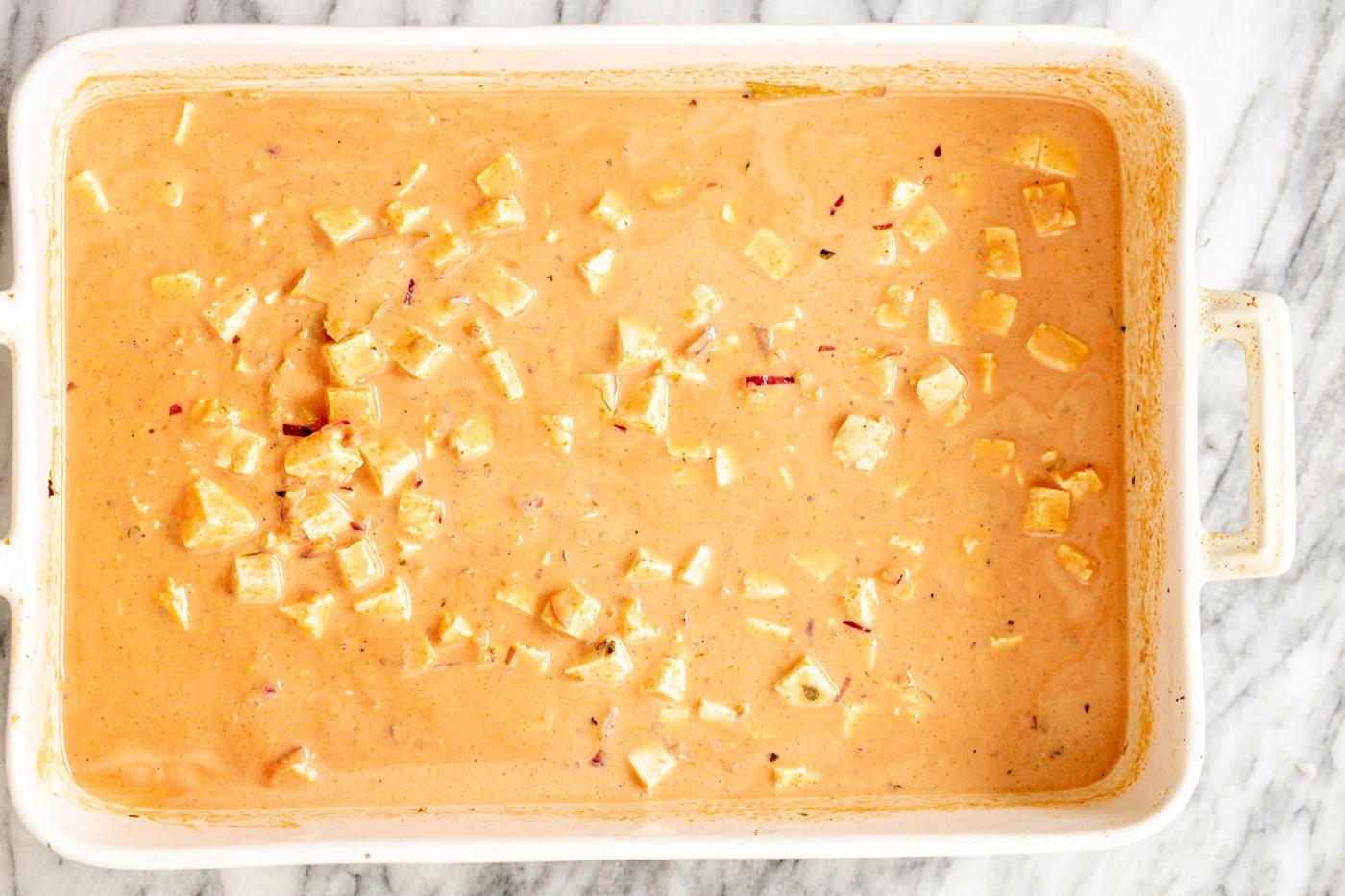 vegan baked tofu in coconut gravy in casserole dish