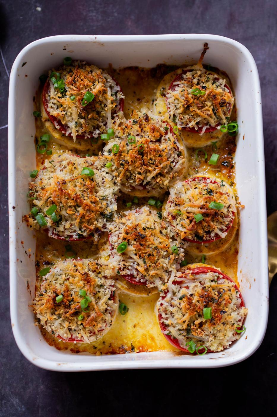 baked vegan caprese stacks in the baking dish, after baking