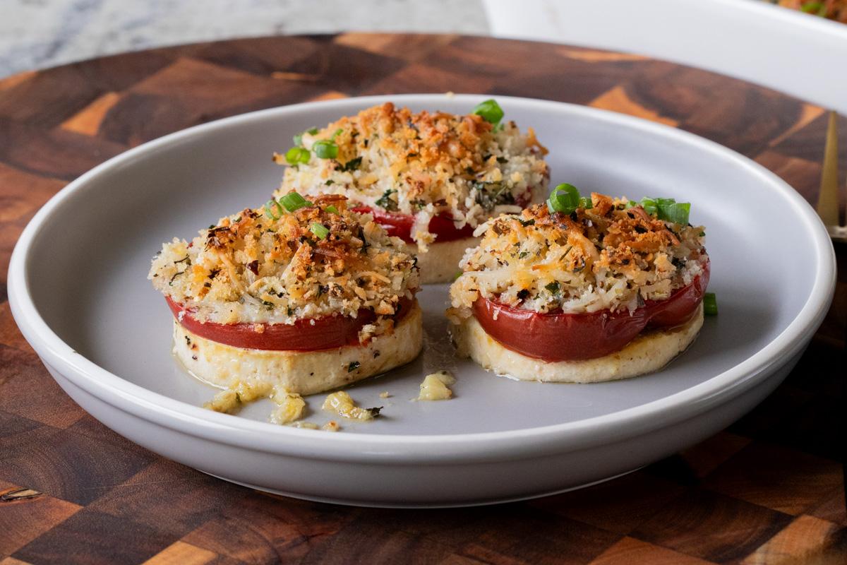 baked vegan caprese stacks on a plate