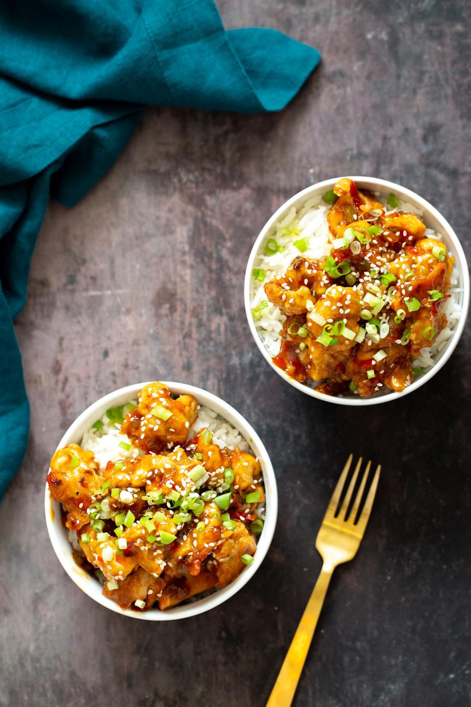 two servings of general tso cauliflower served over rice