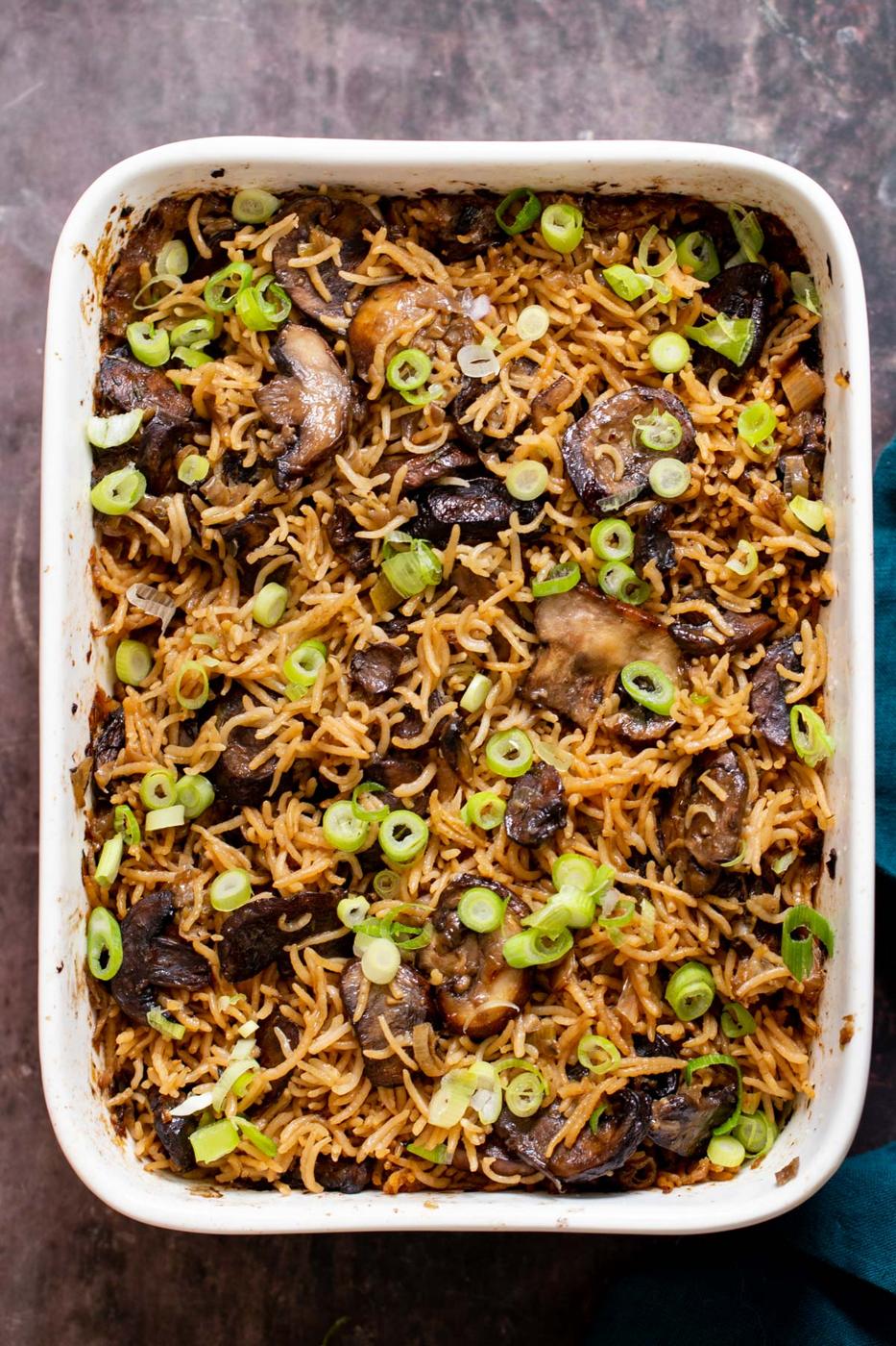 a casserole dish with vegan baked mushroom rice