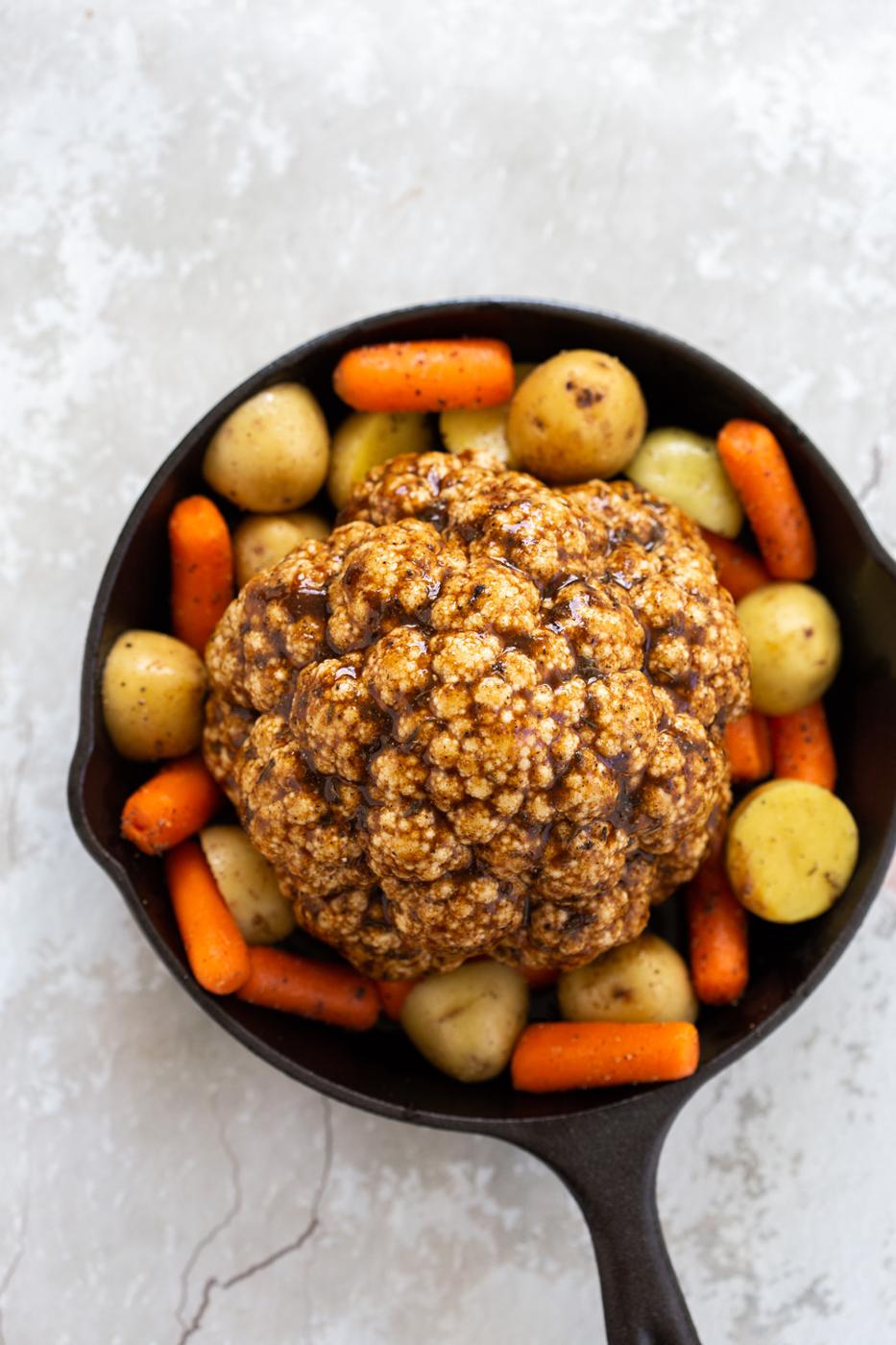 Whole Roasted Cauliflower. This Baked Whole Roasted Cauliflower is marinated in flavorful of herbs and spices and baked to perfection to make a fabulous Holiday table option. #VeganRicha #holiday #Vegan #Glutenfree #Nutfree #recipe. Can be #soyfree