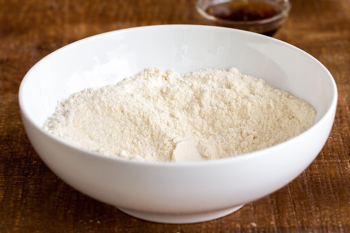 dry ingredients for vegan baklava cookies in a white bowl