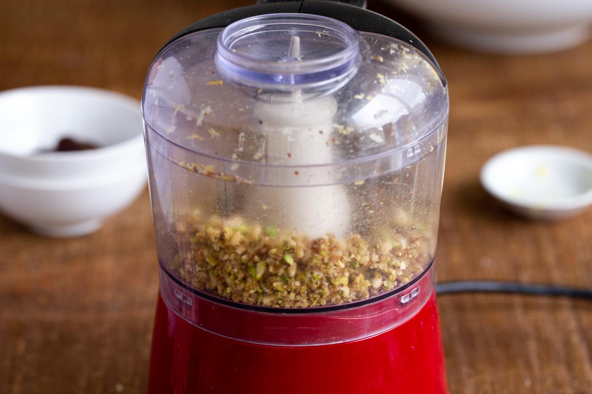 lemon zest and pistachios in a small food processor