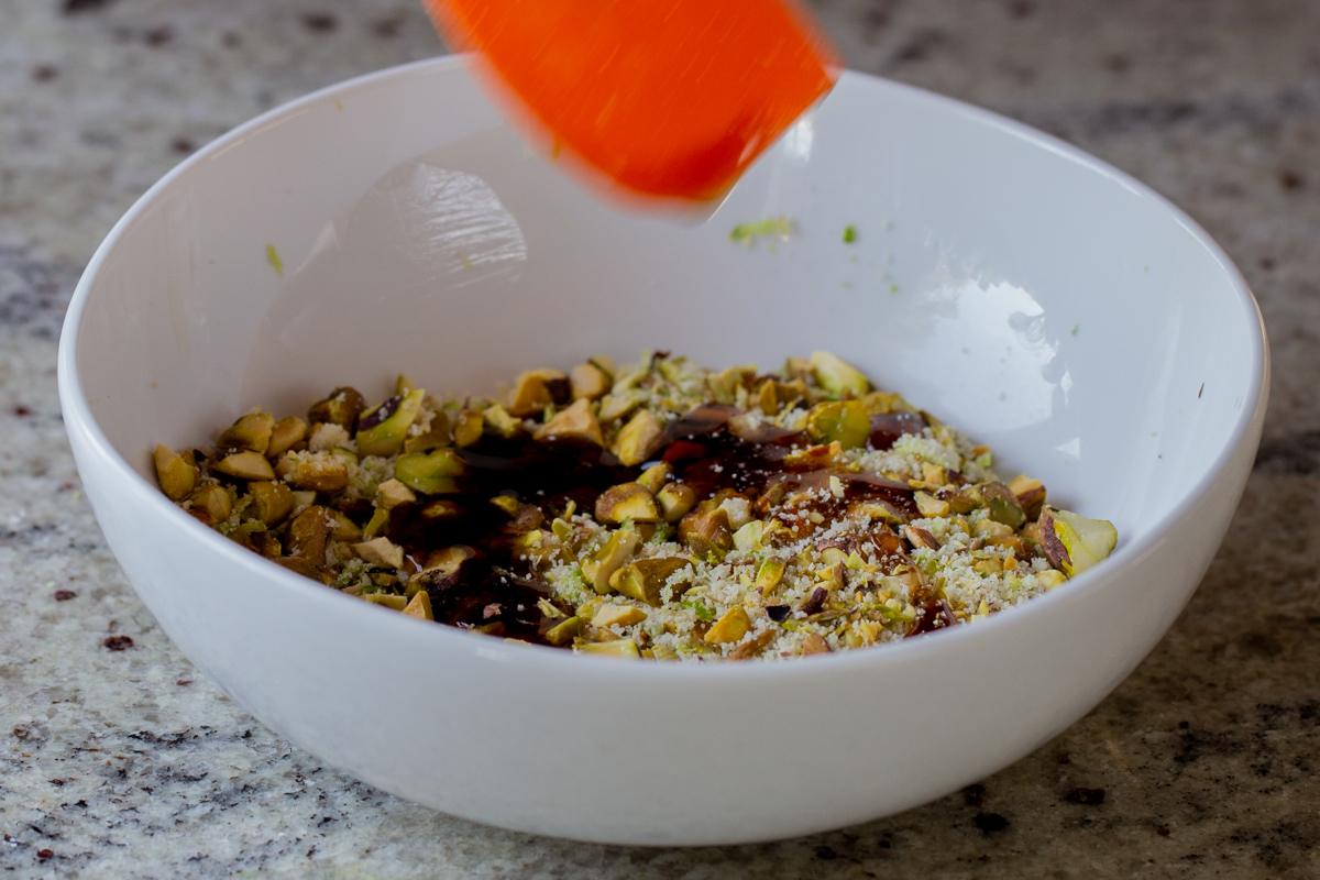 adding maple syrup to the nut mixture