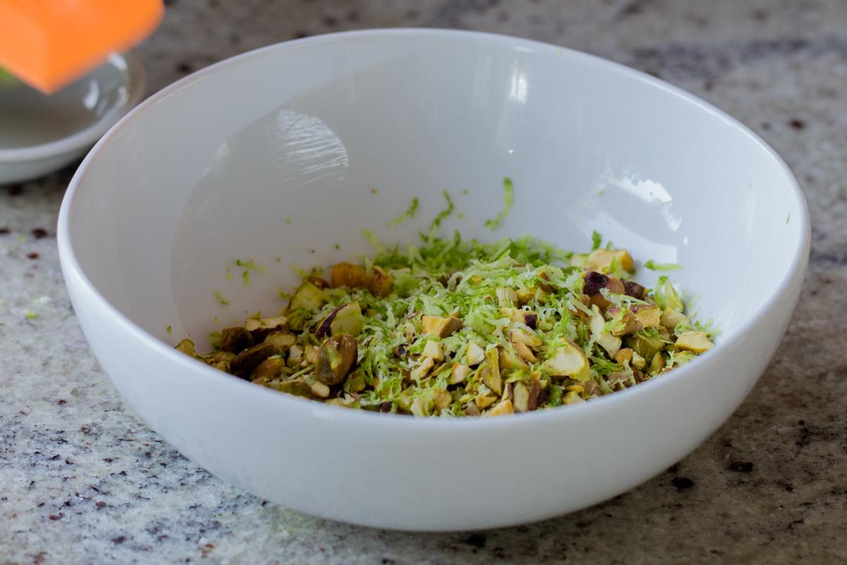 lime zest and chopped pistachios in the bowl