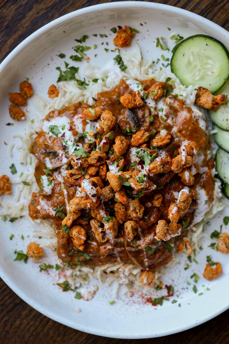 balchao mushrooms over rice topped with crispy beans