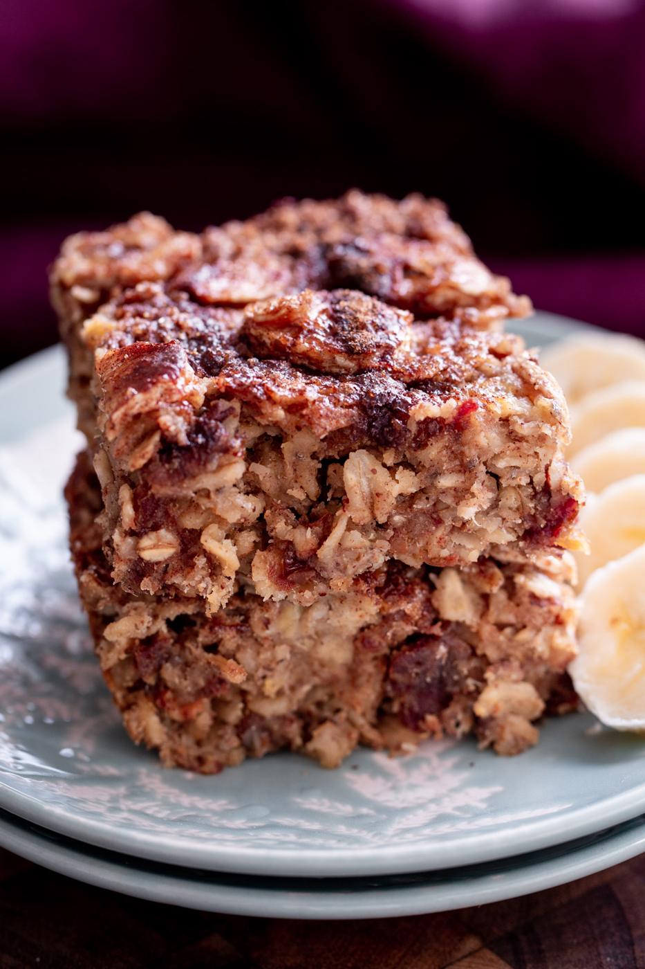 stacked vegan banana oatmeal bars with cinnamon crumb topping