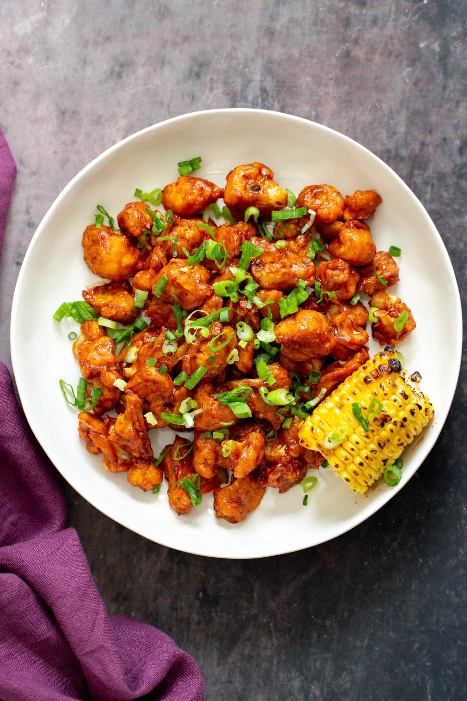 baked bbq cauliflower wings sprinkled with chopped green onion