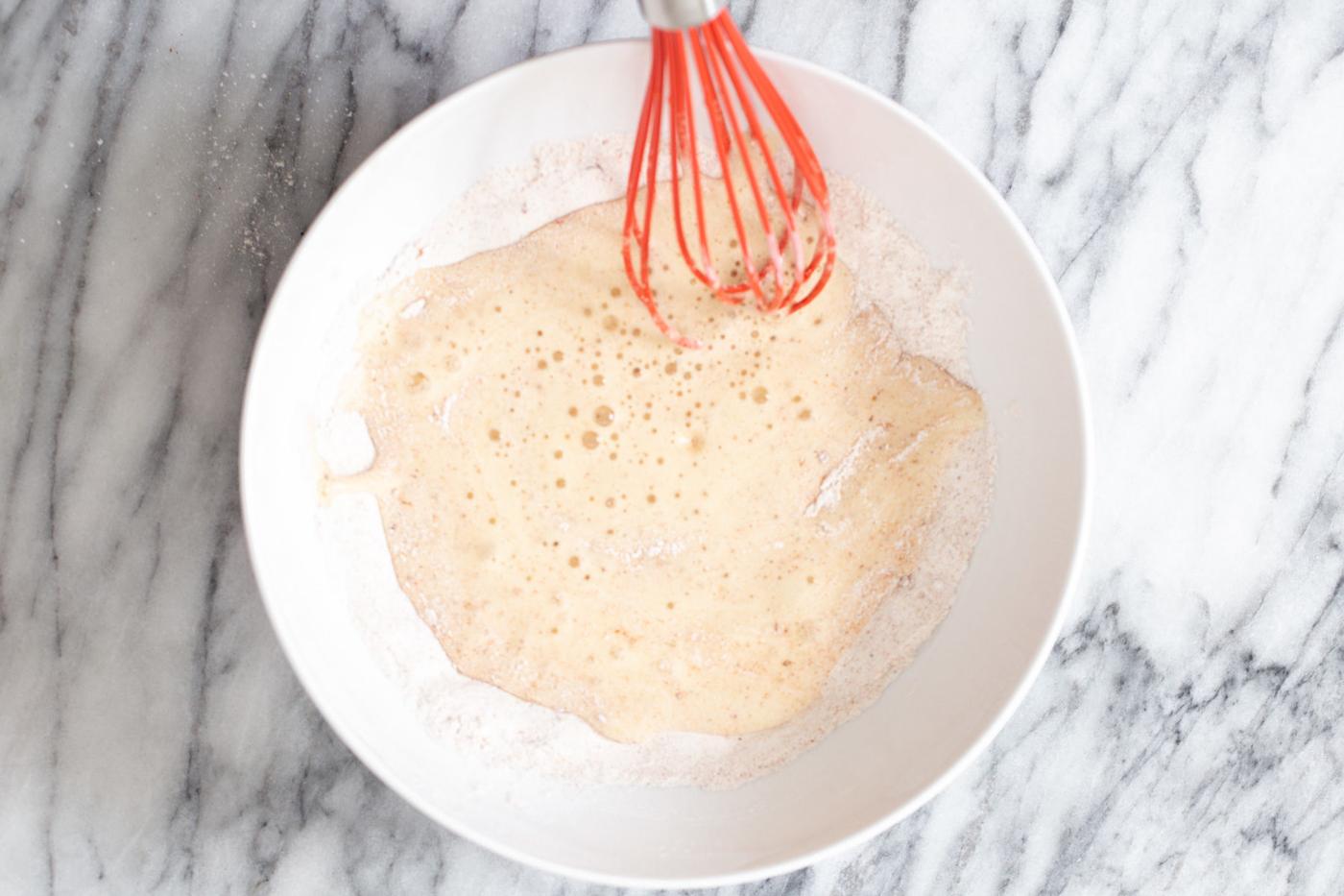vegan beer batter being mixed in a small white bowl