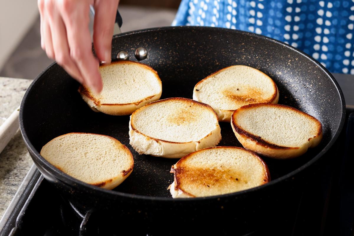 toasting the buns in the pan