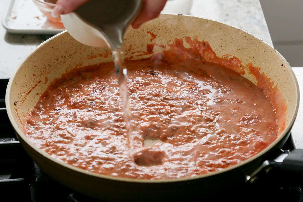 adding water to the simple rosé sauce