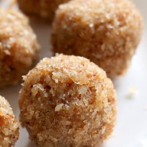 Toasted Coconut Balls - Toasted Coconut Cardamom Ladoo. Soft balls of coconut, coconut milk, cardamom and coconut sugar to celebrate Indian festivals. Use other flavors of choice. | VeganRicha.com