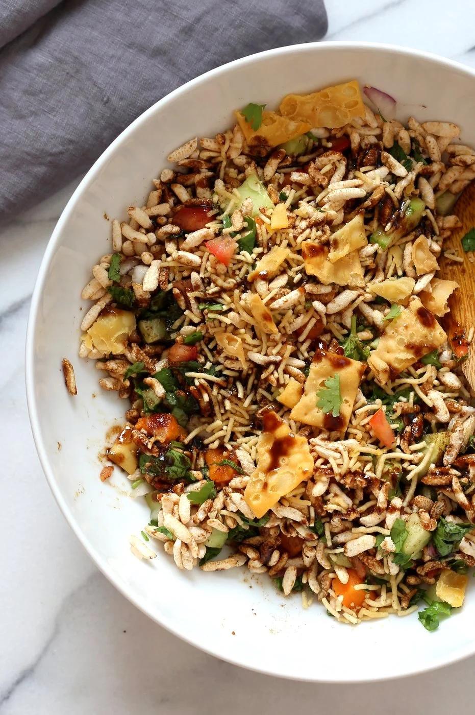 Sweet Potato Bhel Recipe - Indian Street Food style Snack Salad with Mint and Tamarind Chutney. Puffed Rice tossed with cooked sweet potato, nuts, onion, cucumber and tomato and dressed in chopped mint and 5 minute Tamarind Chutney. Vegan Bhel Puri Recipe. Can be glutenfree and nutfree. | VeganRicha.com
