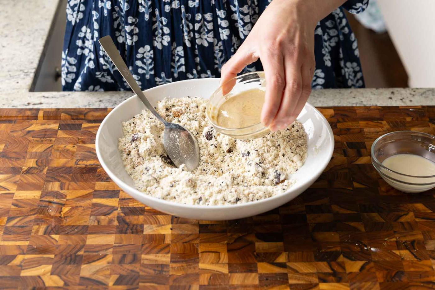 adding wet ingredients to the bowl