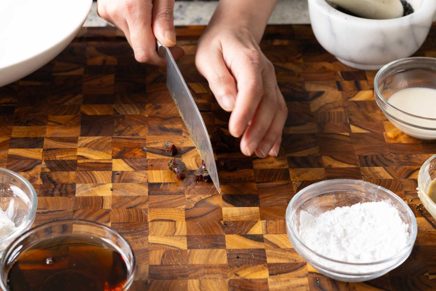 chopping the dates on a cutting board