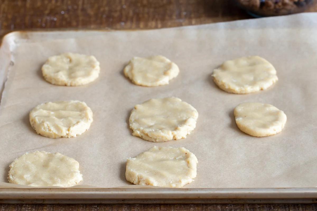 vegan almond flour cookie dough on a lined baking sheet