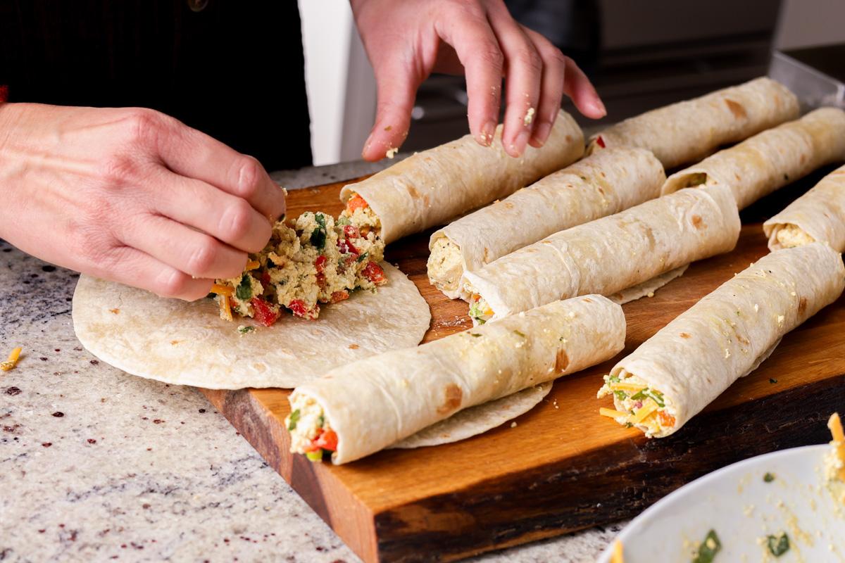 adding filling to the tortillas