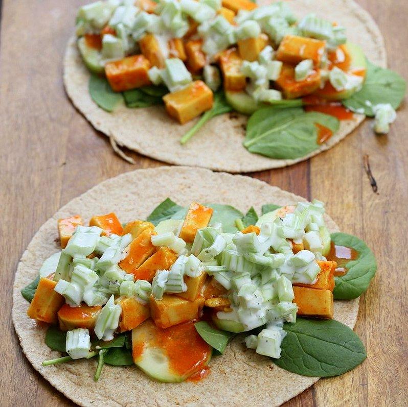 Buffalo Tofu wrap with Chickpea Tofu. Soy-free Chickpea flour Tofu tossed in buffalo hot sauce, layered with celery, spinach, cucumbers and vegan ranch. Easy weekday meal Recipe | VeganRicha.com