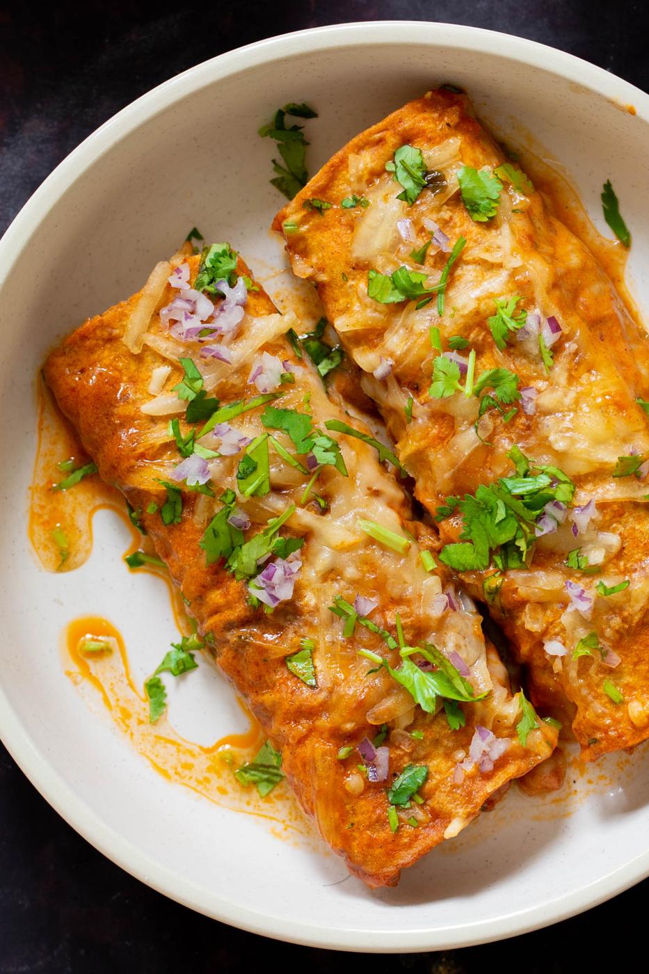 close-up of butter chicken enchiladas on the plate