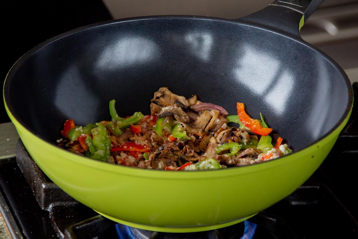peppers and mushrooms in the wok, after cooking