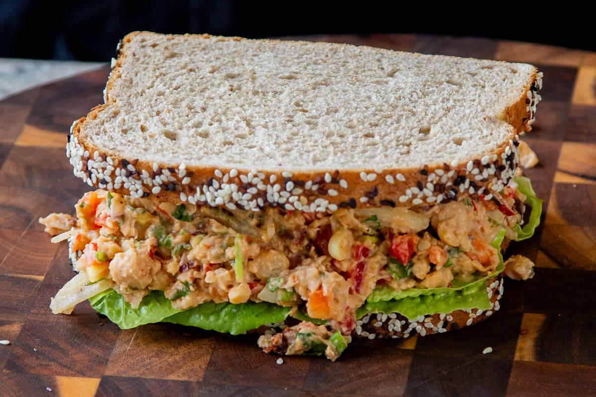 cajun chickpea salad in a sandwich with lettuce