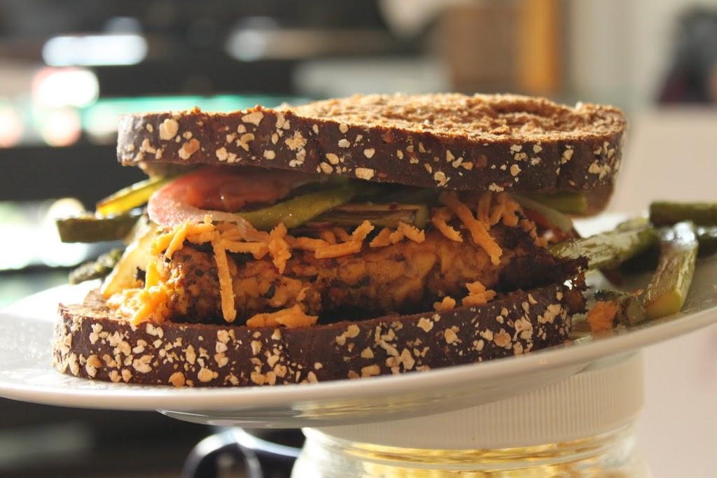 Cajun Spiced Tempeh Burger, asparagus, onions and tomato sandwich!