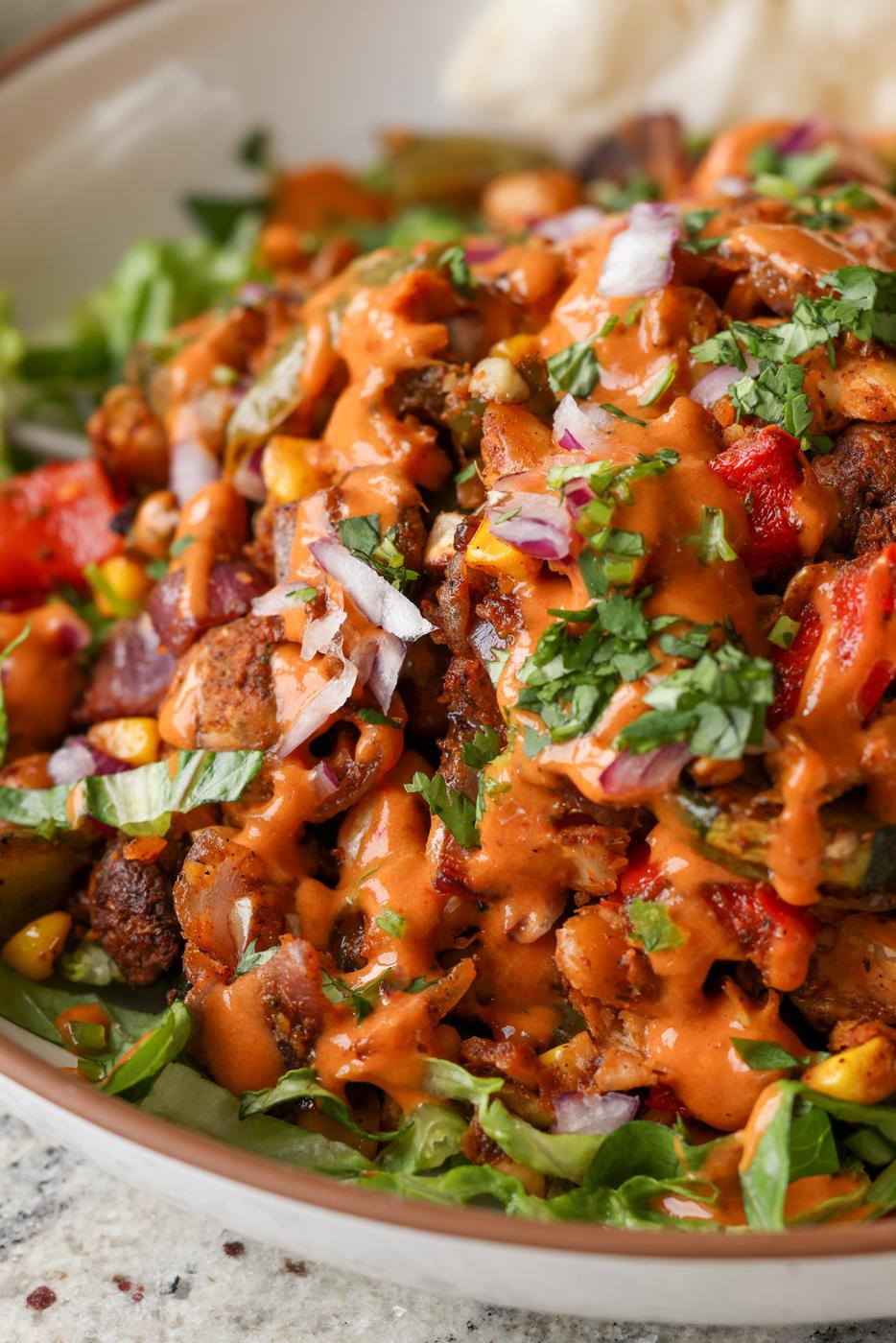 close-up of cajun sheet pan beans veggies in a bowl